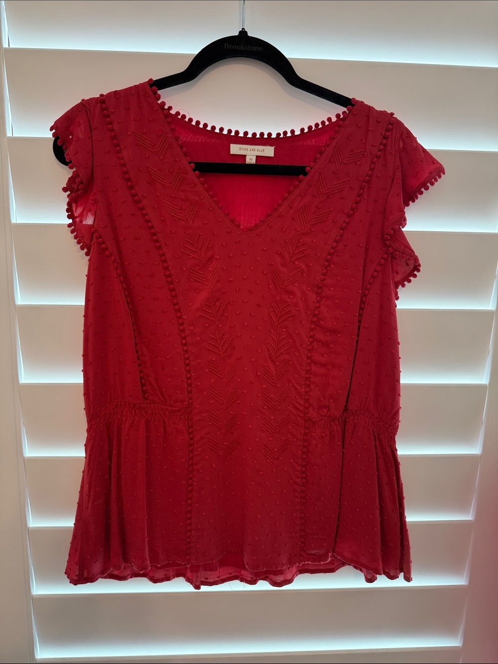 Skies Are Blue Crimson V‑Neck Pom Trim Peplum Blouse
